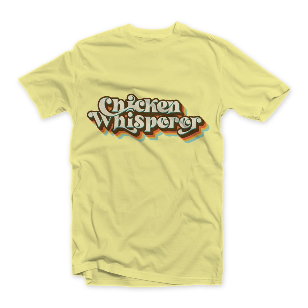 Chicken Whisperper T-shirt Retro 70s 80s Brown Design on Yellow Short Sleeve tee